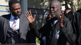 Attorney Dante Pride and Marcus Evans' uncle, Anthony Evans, speak outside of the San Diego Police Department Southeastern Division Station on Wednesday, Nov. 13, 2024.