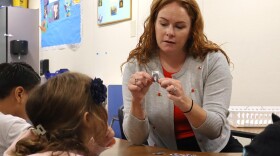 Grindl McMahon helps a student with an activity during a Parent Empowerment Program session in the La Mesa-Spring Valley School District on June 3, 2025.