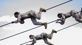 Female Marine recruits on the Slide for Life obstacle course at Marine Corps Recruit Depot, San Diego, March 9, 2021.