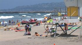 People enjoying the sand and surf in Ocean Beach. August 1, 2014