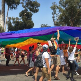 San Diego Pride attendees march during the parade, July 2017. 