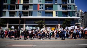 Thousands of people march through downtown San Diego as part of the nationwide "Hands Off!" protest movement on Saturday, April 5, 2025. 