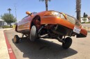 Deanna Garcia's 2000 Lincoln Town Car uses hydraulics to only have three wheels touching the ground, May 6, 2022.