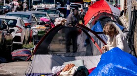 Tents and people experiencing homelessness line the streets in the southern portion of downtown San Diego, Oct. 25, 2022.